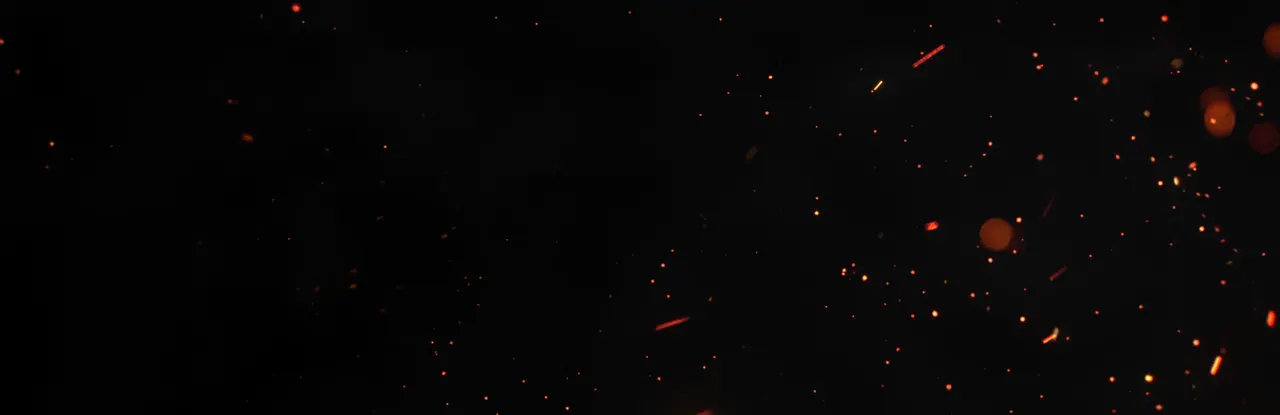 Dark cinematic banner with orange sparks scattered across a black background