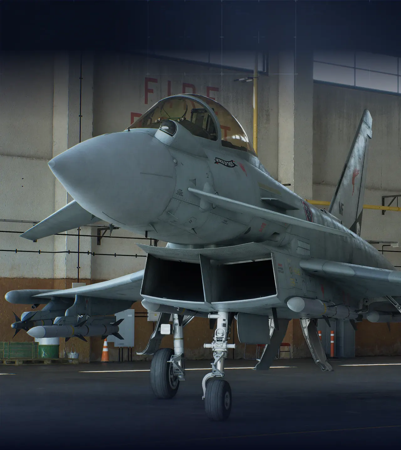 Gray fighter jet parked on the apron viewed from a three-quarter angle